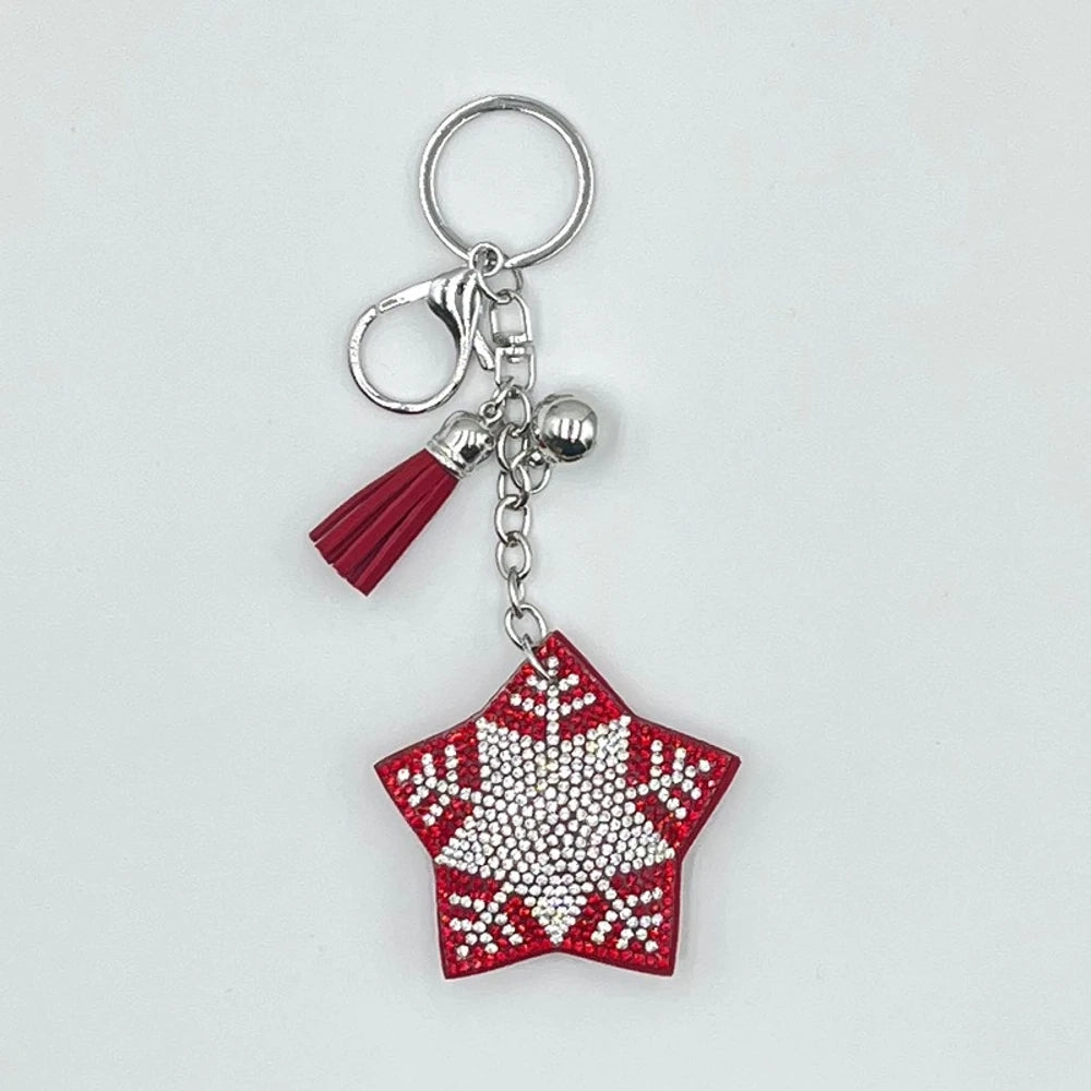 Set of 6 Christmas diamond painting keychains featuring Santa Claus, reindeer, Christmas tree, star, jingle bells, and mitten designs with tassels and jingle bell charms on silver and gold rings. - Snowflake