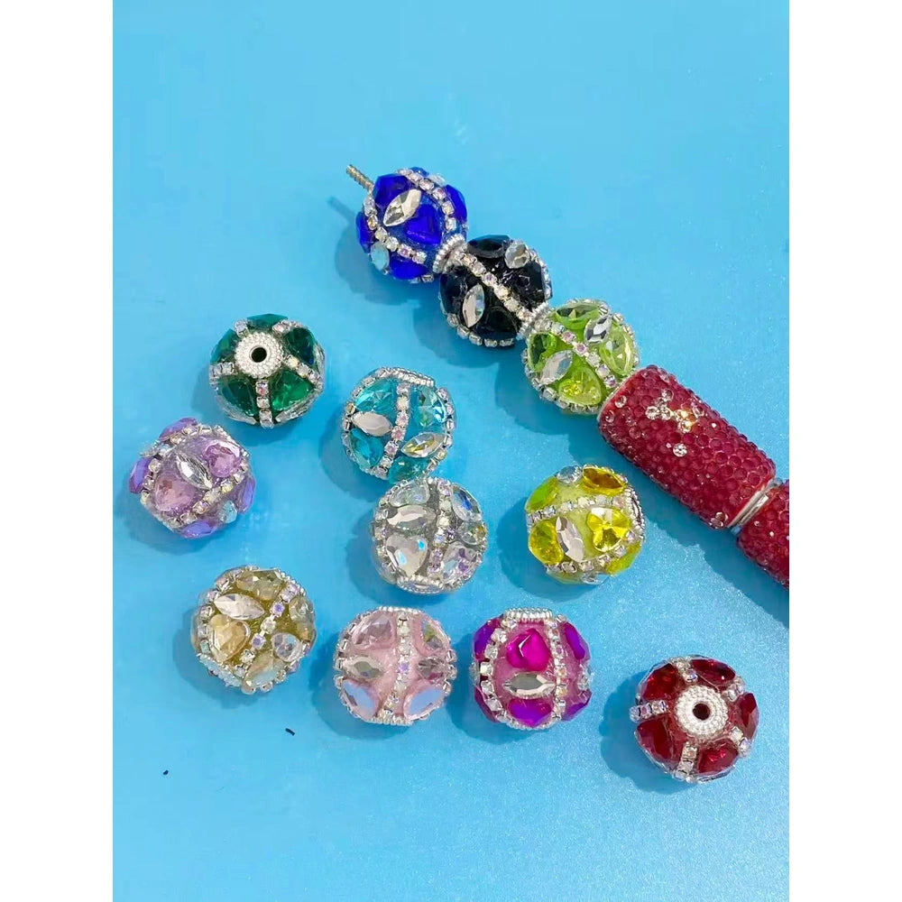 Mixed color rhinestone fancy beads with center holes for pens, bracelets, keychains, and jewelry making.