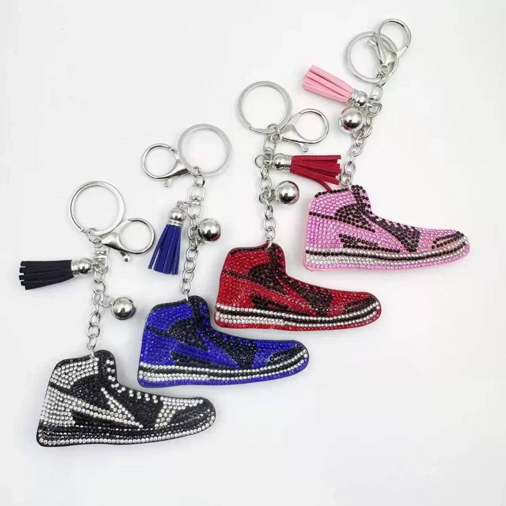 Four assorted rhinestone high-top sneaker fancy beads in black, blue, red, and pink keychain style charms on a white background - Random Mixed