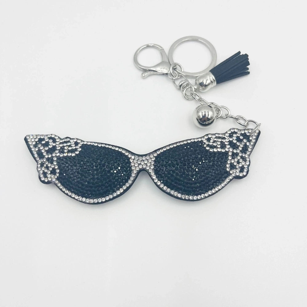 Navy blue rhinestone cat eye sunglasses keychain charm with silver tassel, bell, and lobster clasp for DIY jewelry making and beadable pens.