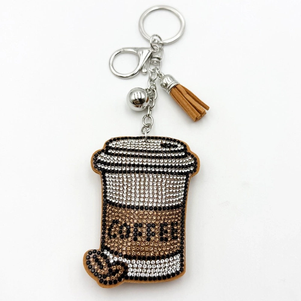 Sparkling rhinestone coffee cup keychain charm with brown tassel and silver bell, featuring crystal and champagne colored beads spelling COFFEE on a lobster clasp key ring.