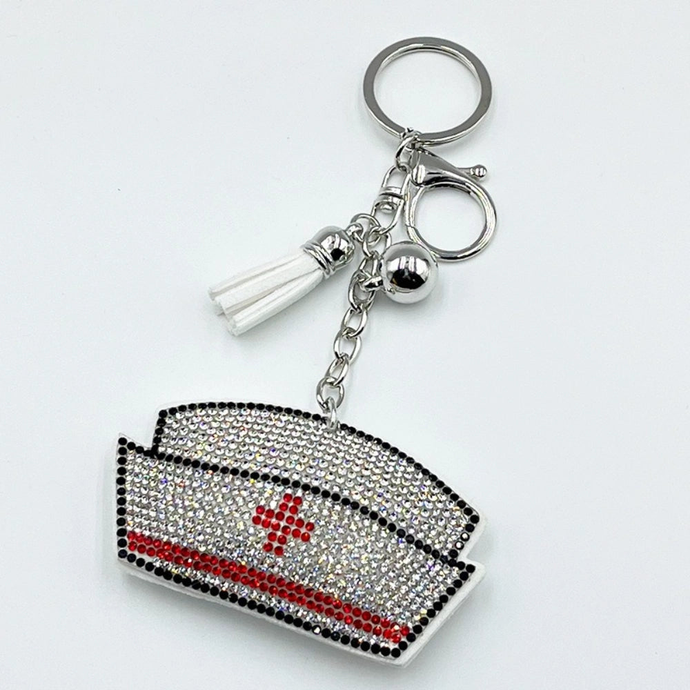 Crystal rhinestone nurse hat keychain charm with red cross design, black border, white tassel and silver lobster clasp for DIY jewelry making