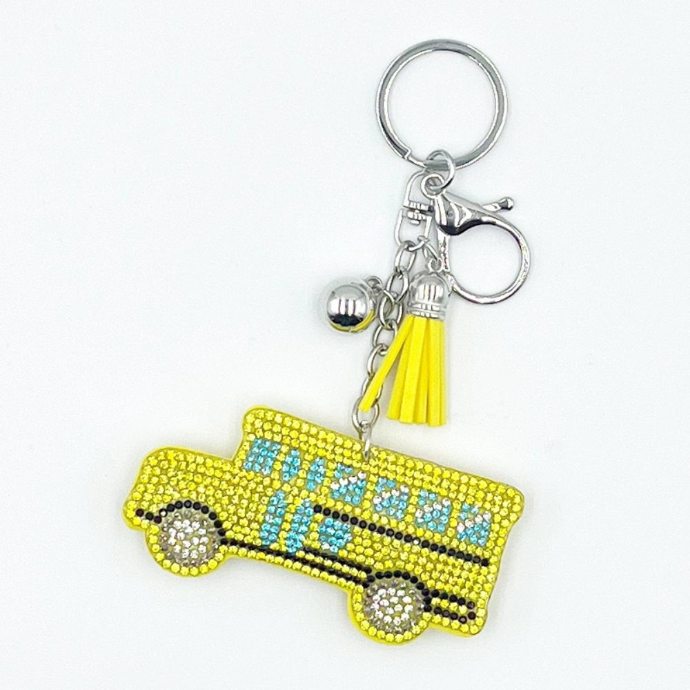 Yellow rhinestone crystal school bus keychain charm with blue crystal windows, silver ball bead, yellow tassel, and lobster clasp on silver key ring.
