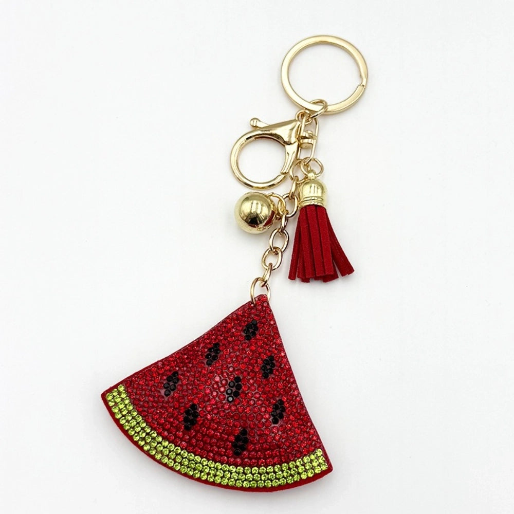 Three rhinestone watermelon slice keychain charms with red tassels, gold beads, and lobster clasp hardware on white background - 2