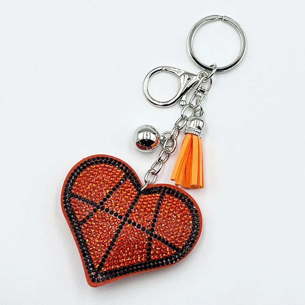 Assorted heart-shaped sports rhinestone fancy beads in baseball, football, basketball, volleyball, and tennis designs with tassel keychain hardware. - Orang Red