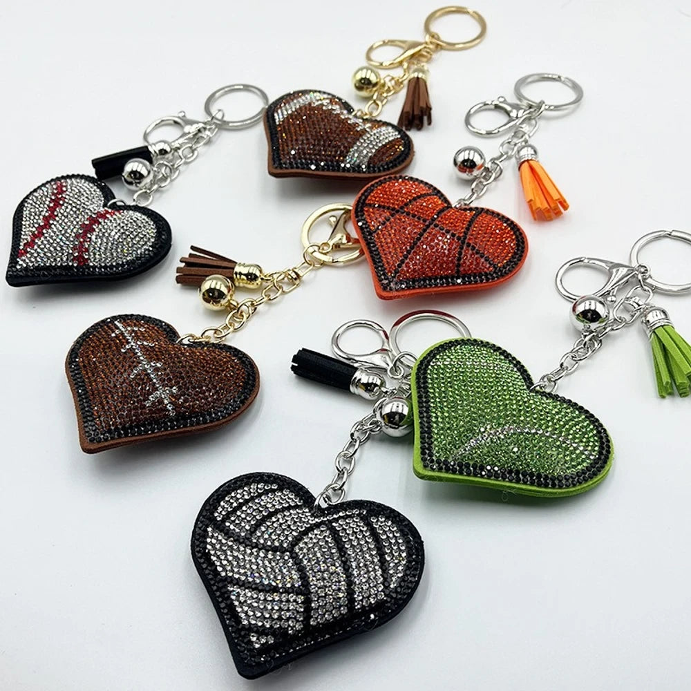 Assorted heart-shaped sports rhinestone fancy beads in baseball, football, basketball, volleyball, and tennis designs with tassel keychain hardware. - Random Mixed