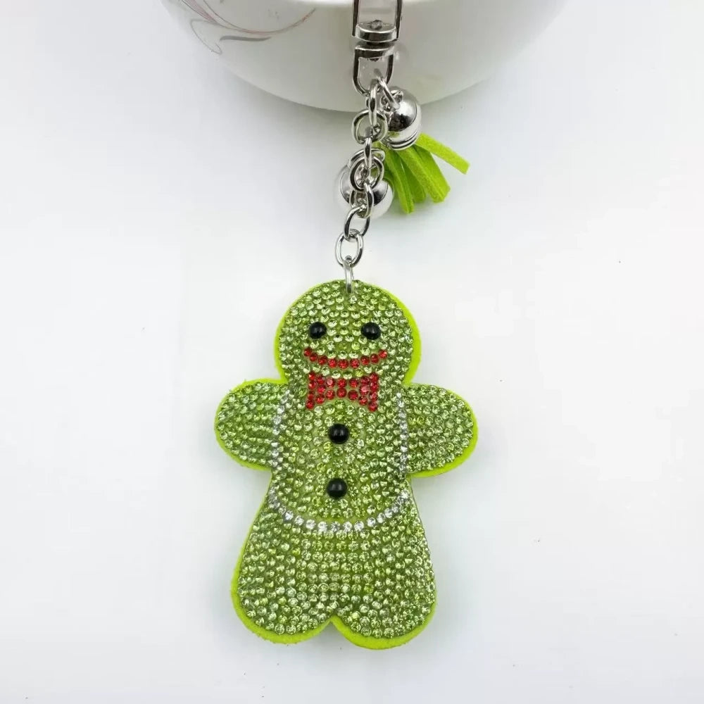 Three rhinestone gingerbread figure keychain charms in brown, pink, and orange with tassels and silver clasp rings - 2