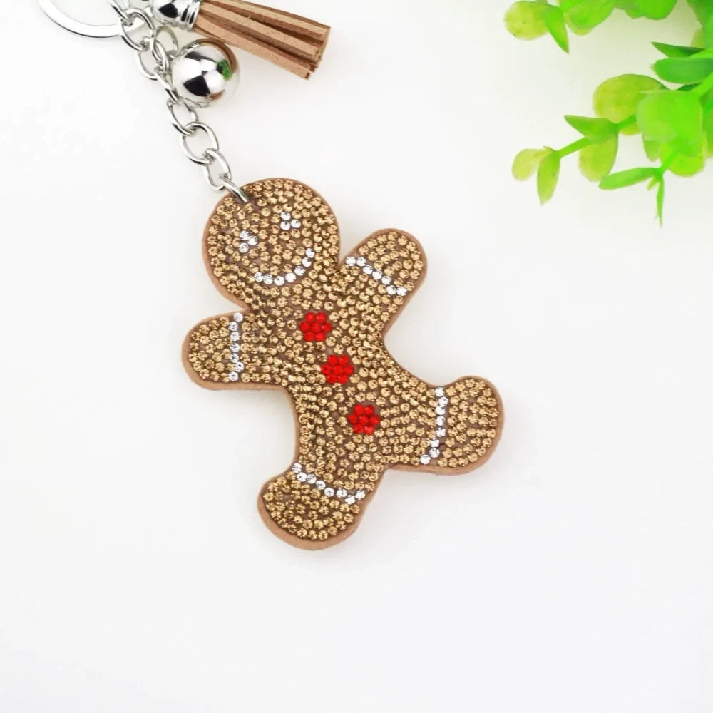 Three rhinestone gingerbread figure keychain charms in brown, pink, and orange with tassels and silver clasp rings - 5