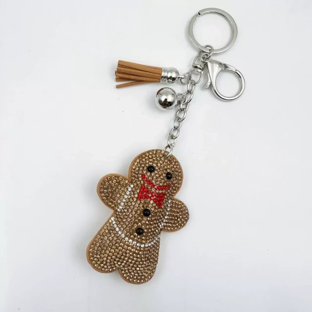 Three rhinestone gingerbread figure keychain charms in brown, pink, and orange with tassels and silver clasp rings - 6