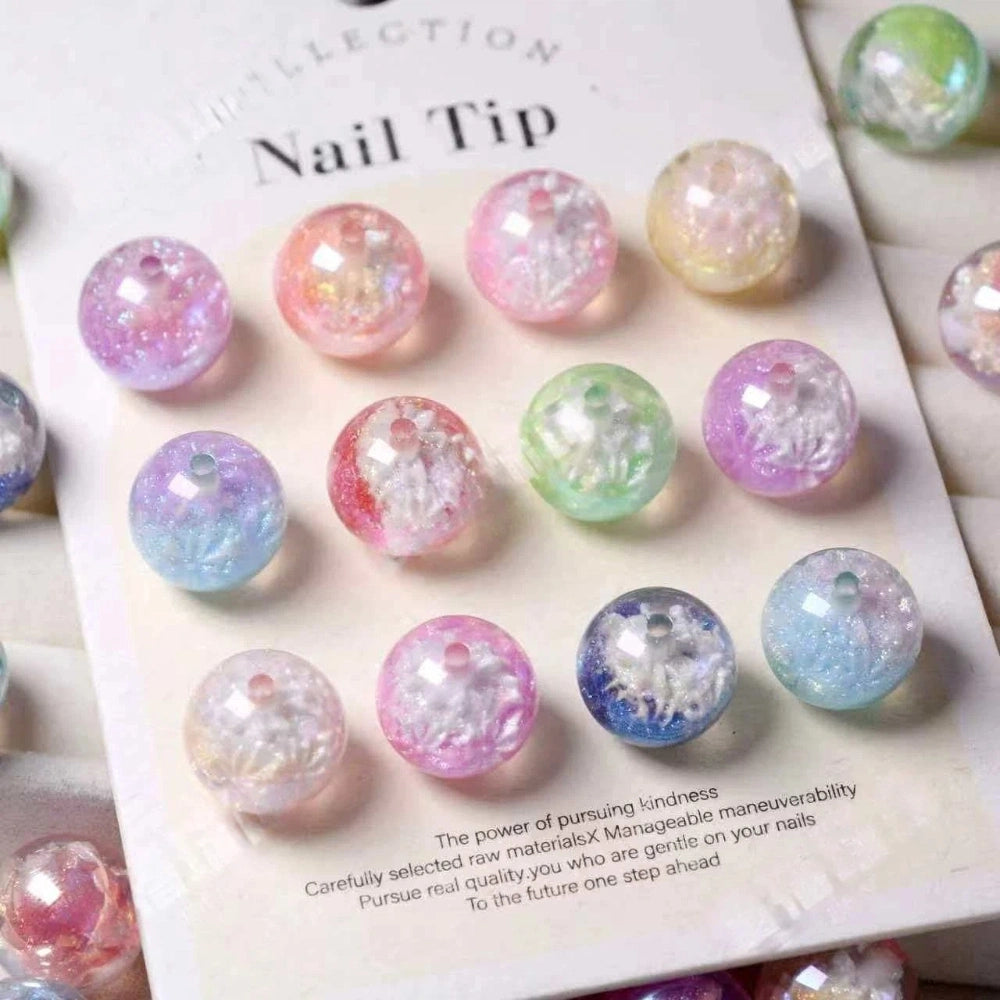 Assorted round 16MM pastel glitter crackle acrylic beads in pink, purple, blue, green, and clear tones on a display card.