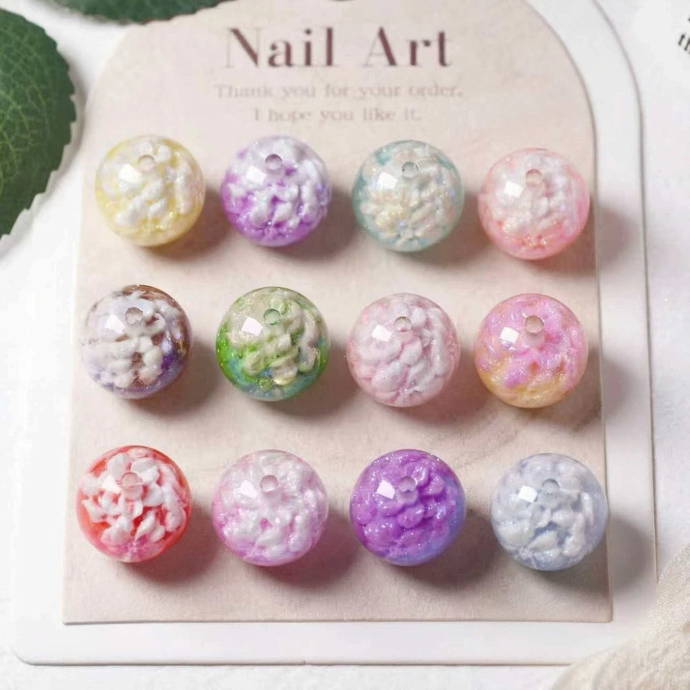 12-piece set of 16MM round acrylic beads featuring cloud and glitter swirl designs in assorted pastel colors including pink, purple, blue, green, and yellow, displayed on a nail art packaging card.