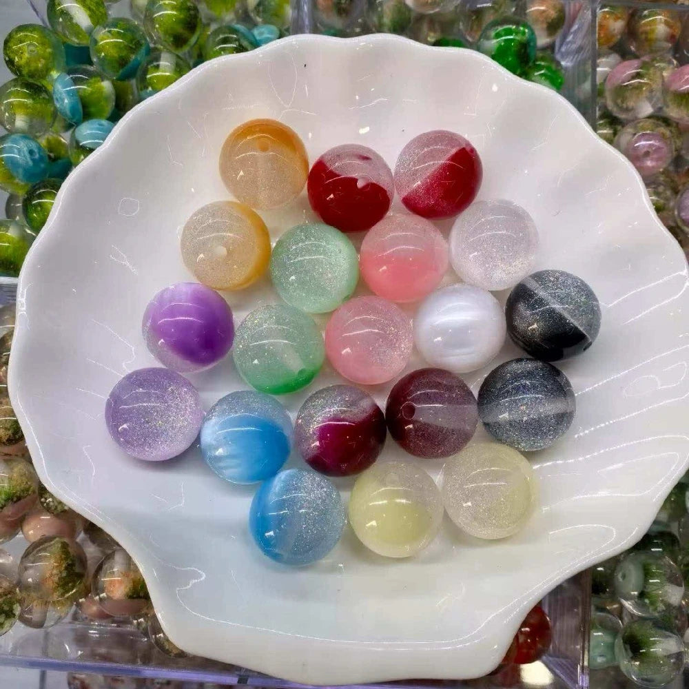 Assorted 20MM mixed-color glitter swirl round acrylic beads in a white shell dish