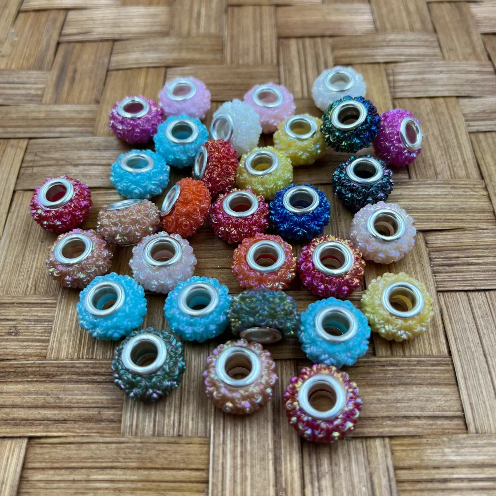 20MM iridescent rose texture acrylic spacer beads in assorted mixed colors with silver metal core holes, displayed on woven bamboo surface for DIY jewelry making and beadable pens.
