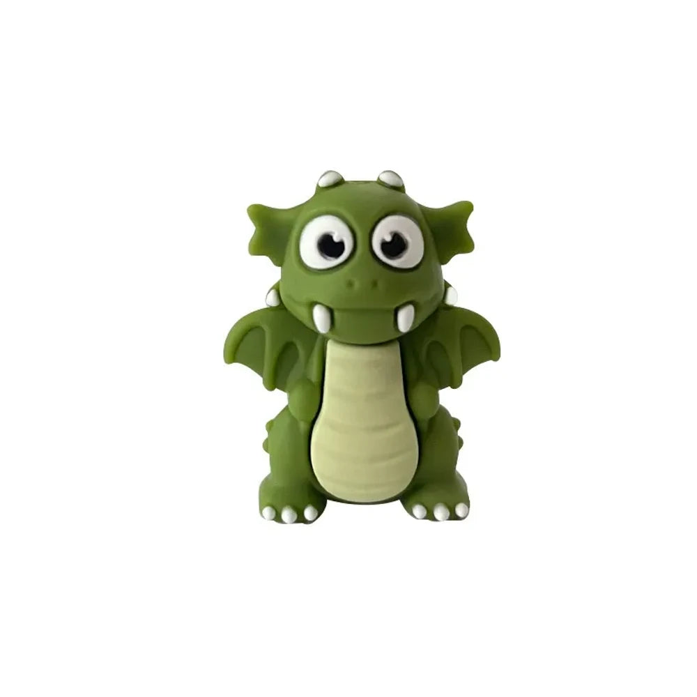 Set of seven 3D cartoon dragon silicone focal beads in black, lime green, dark green, and red colors displayed on and around a miniature white wooden bench against a light green background. - Army Green