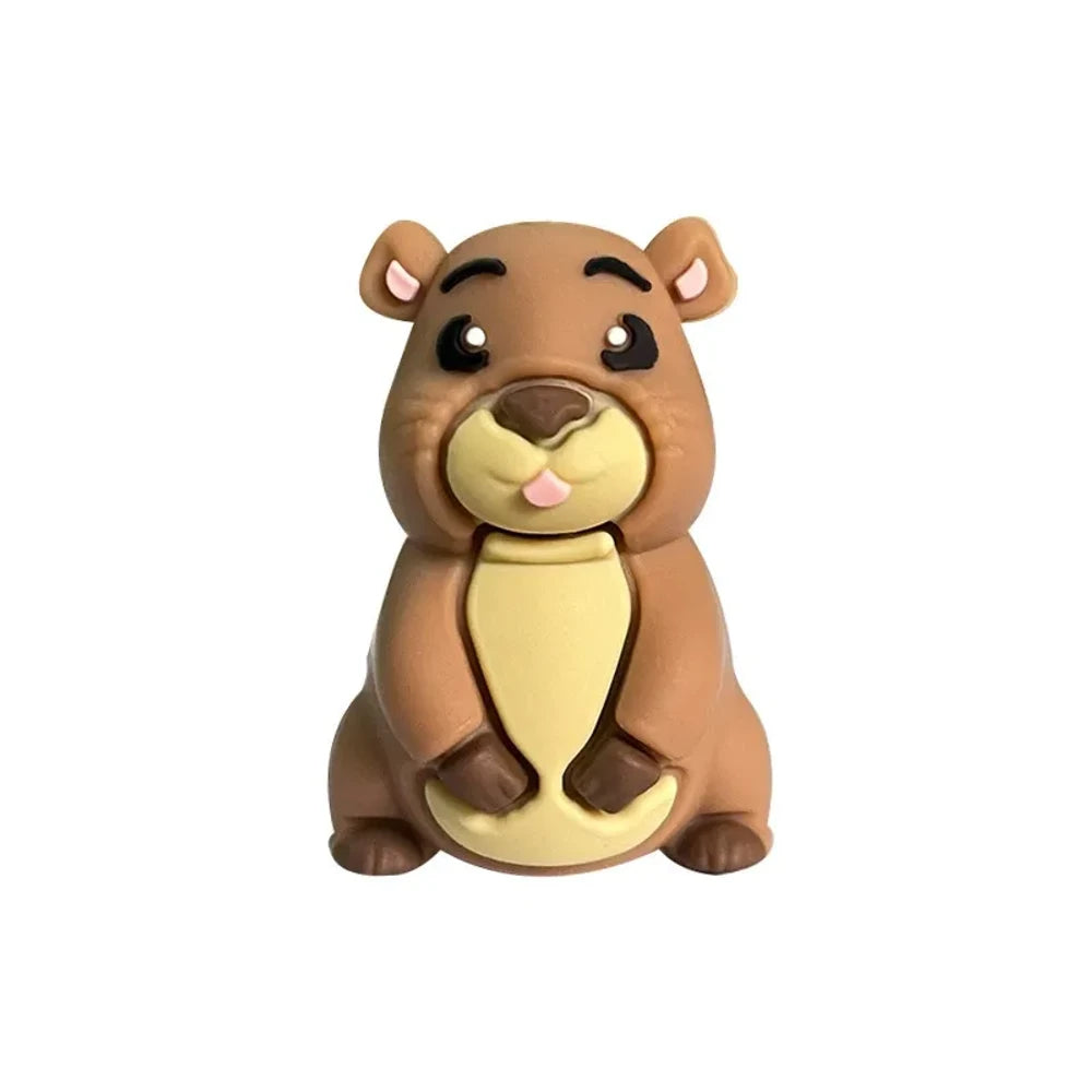 Three 3D groundhog silicone focal beads in light tan, medium brown, and dark brown colors displayed in front of a white ceramic bowl on a beige background. - Camel