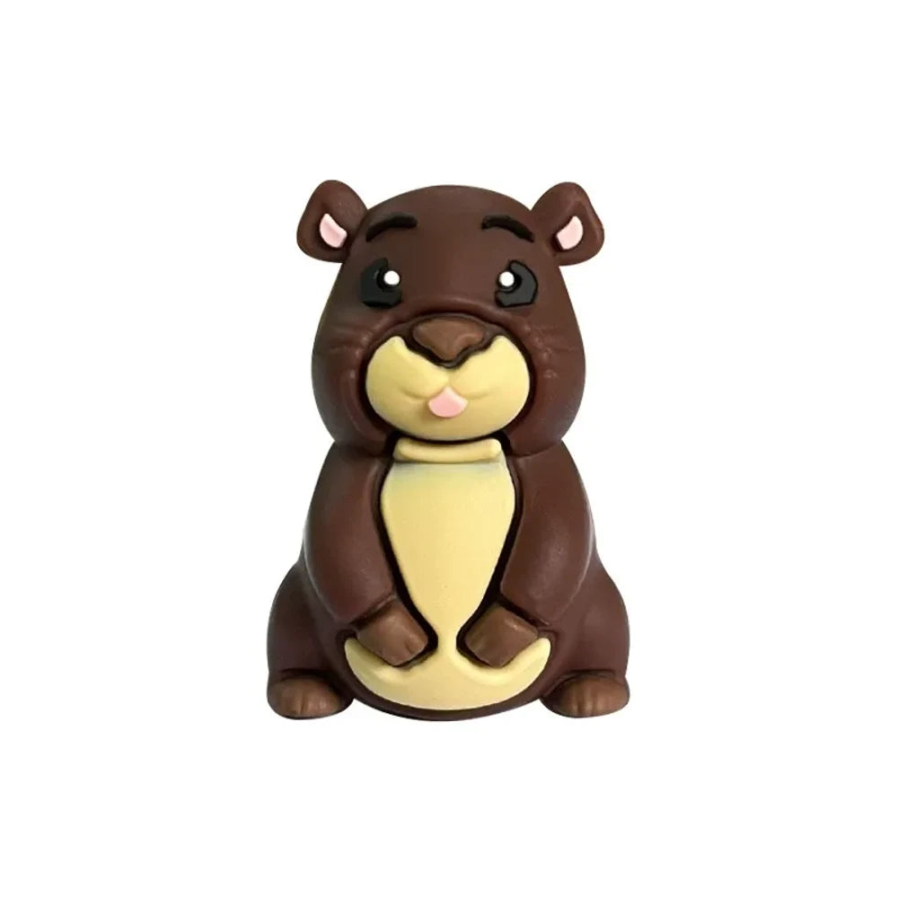 Three 3D groundhog silicone focal beads in light tan, medium brown, and dark brown colors displayed in front of a white ceramic bowl on a beige background. - Coffee