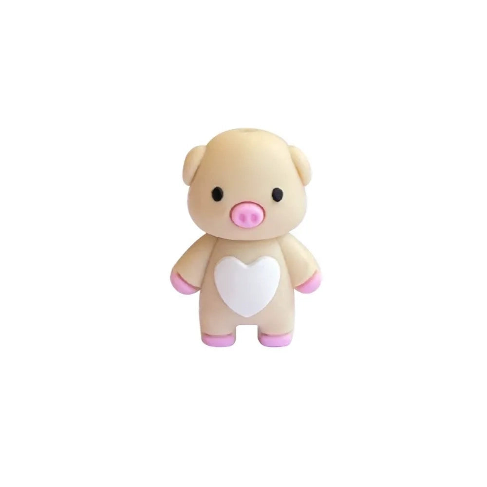 Three cute 3D pig silicone focal beads in pink, cream, and mauve colors, each featuring a white heart on the chest, displayed upright in a clear bead holder. - White