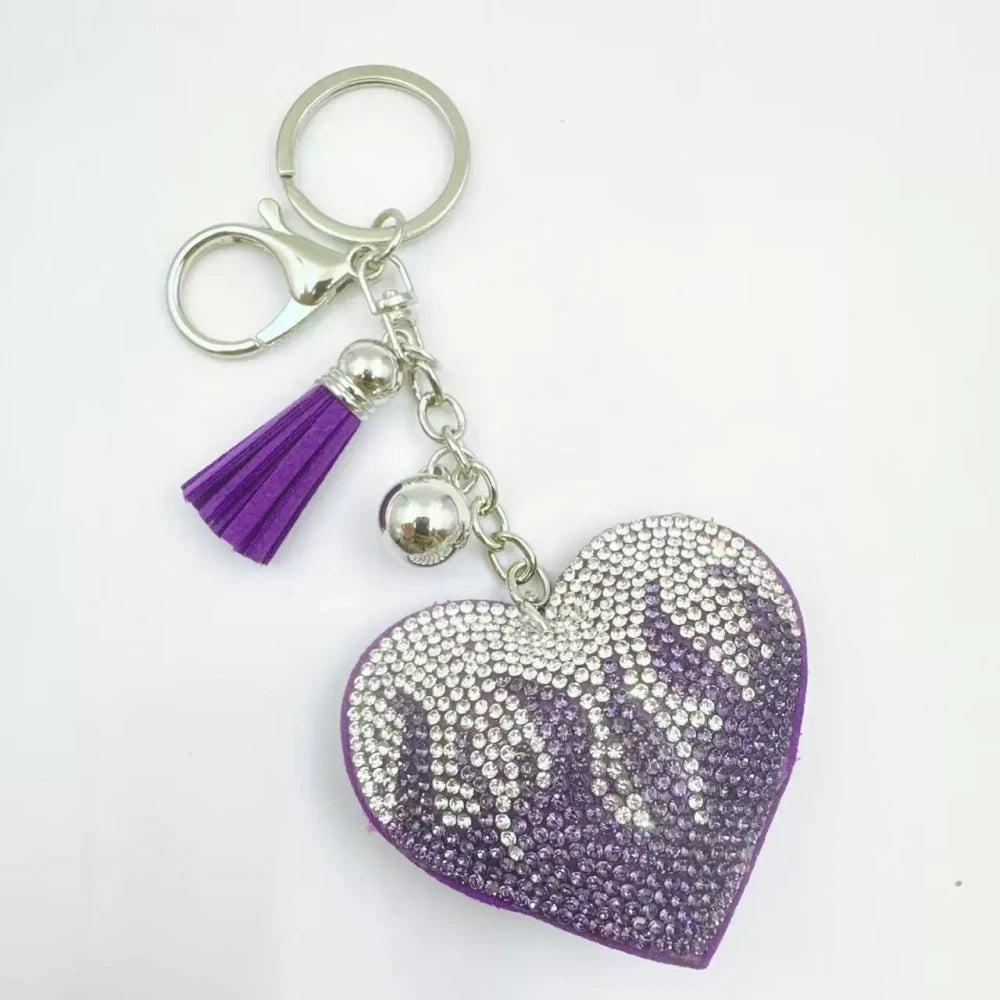 Assorted flame heart rhinestone faux leather fancy beads in green, black, pink, purple, and red with tassel and silver keychain accents - 5