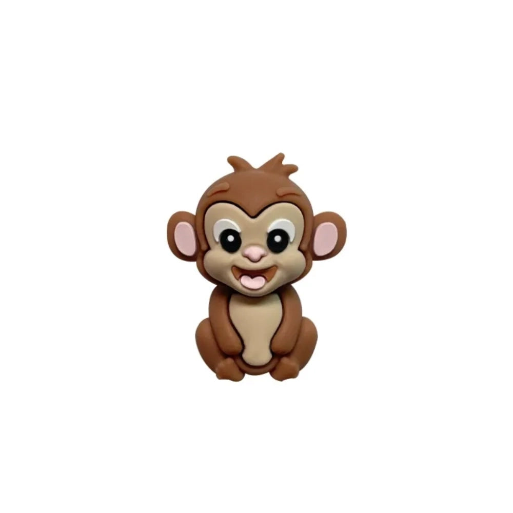 Set of 7 colorful baby monkey 3D silicone focal beads in brown, dark brown, yellow, pink, orange, rust, and purple displayed on a white pedestal with yellow background. - 3