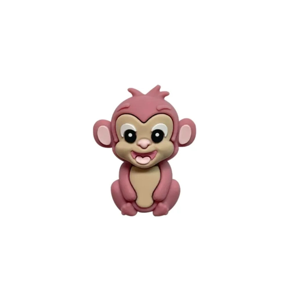 Set of 7 colorful baby monkey 3D silicone focal beads in brown, dark brown, yellow, pink, orange, rust, and purple displayed on a white pedestal with yellow background. - 4