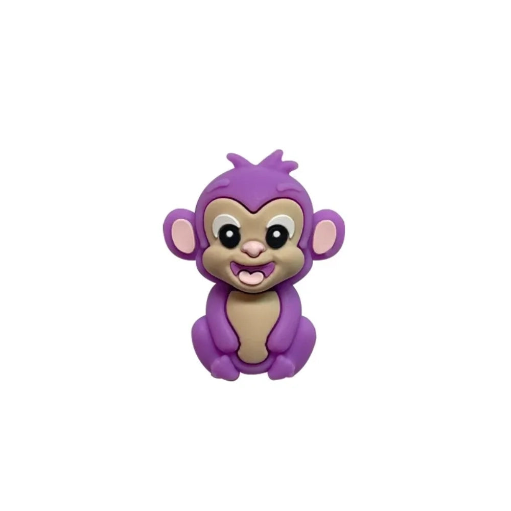 Set of 7 colorful baby monkey 3D silicone focal beads in brown, dark brown, yellow, pink, orange, rust, and purple displayed on a white pedestal with yellow background. - 5