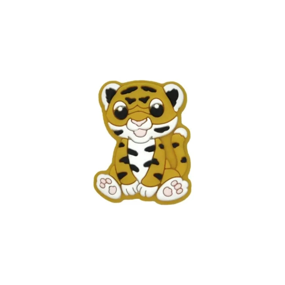 Seven colorful baby tiger silicone focal beads in yellow, brown, gray, orange, pink, white, and mint displayed on a miniature white bench against a teal background. - 1