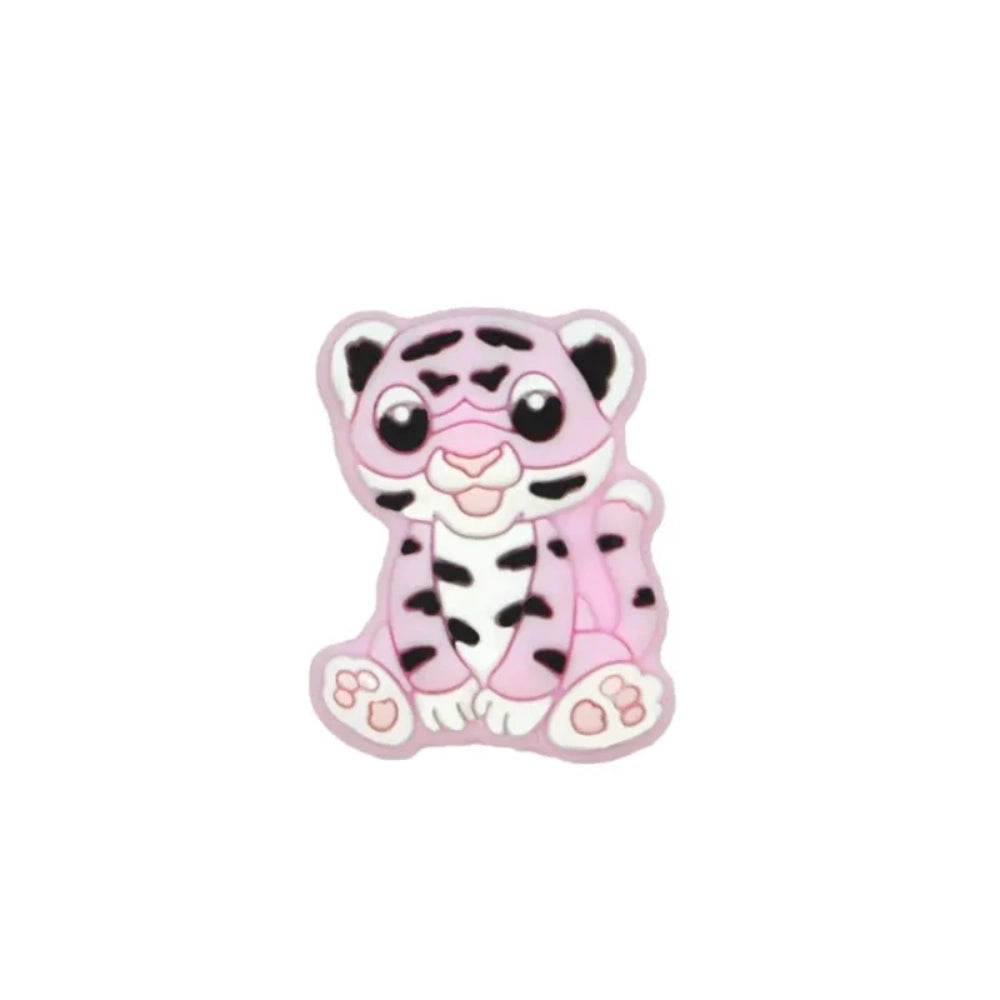 Seven colorful baby tiger silicone focal beads in yellow, brown, gray, orange, pink, white, and mint displayed on a miniature white bench against a teal background. - 3
