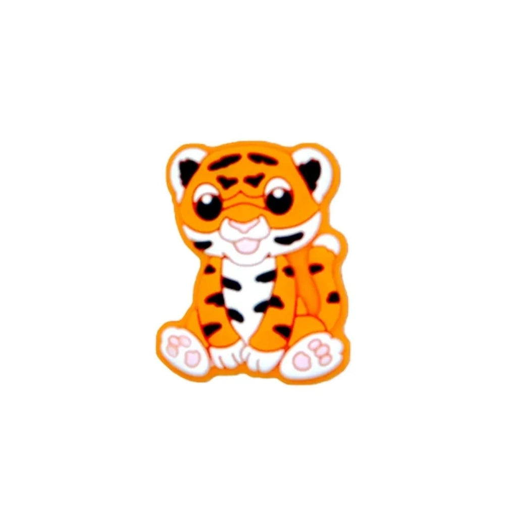 Seven colorful baby tiger silicone focal beads in yellow, brown, gray, orange, pink, white, and mint displayed on a miniature white bench against a teal background. - 4