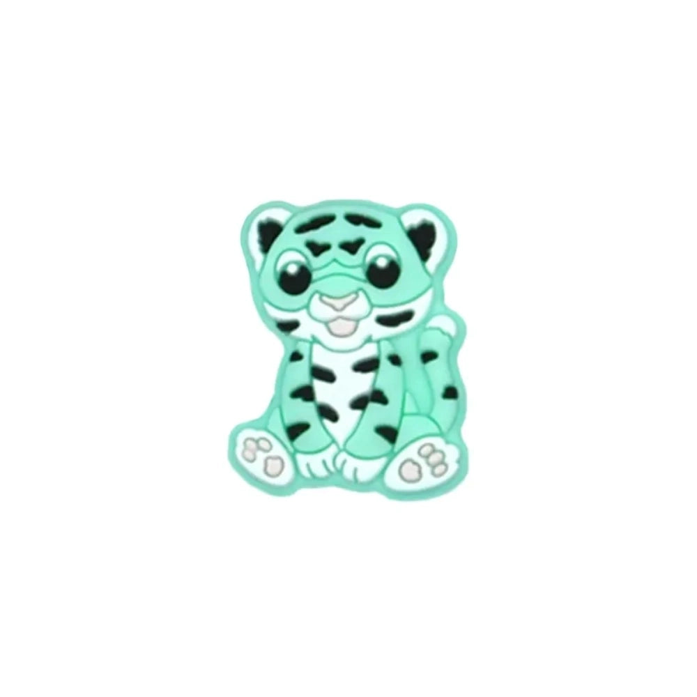 Seven colorful baby tiger silicone focal beads in yellow, brown, gray, orange, pink, white, and mint displayed on a miniature white bench against a teal background. - 5