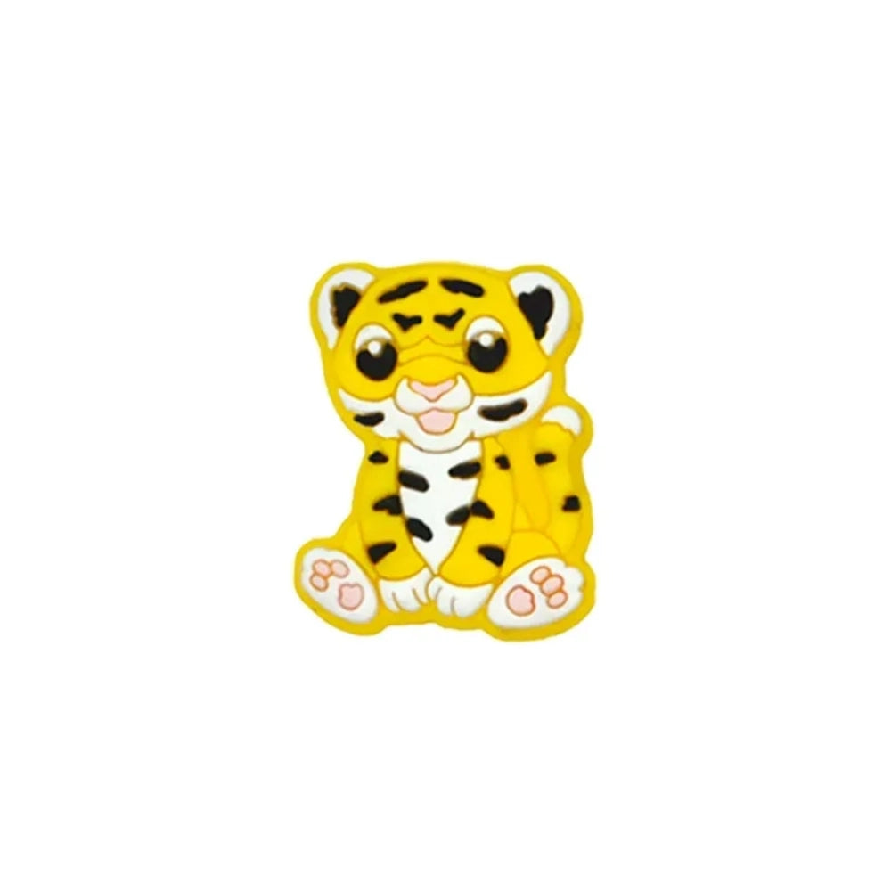 Seven colorful baby tiger silicone focal beads in yellow, brown, gray, orange, pink, white, and mint displayed on a miniature white bench against a teal background. - 6
