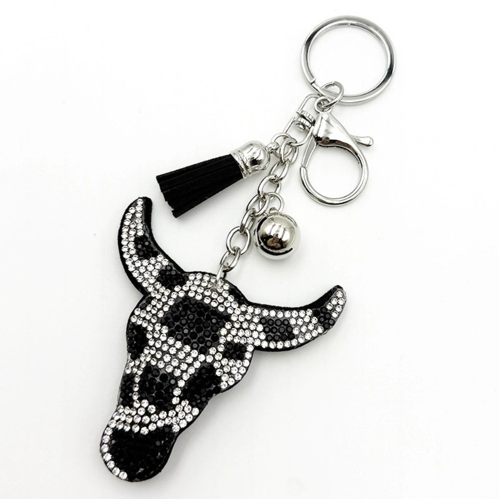 Black and silver crystal rhinestone bull skull keychain charm with black tassel and silver bell on chain clasp, western cowboy style DIY jewelry accessory