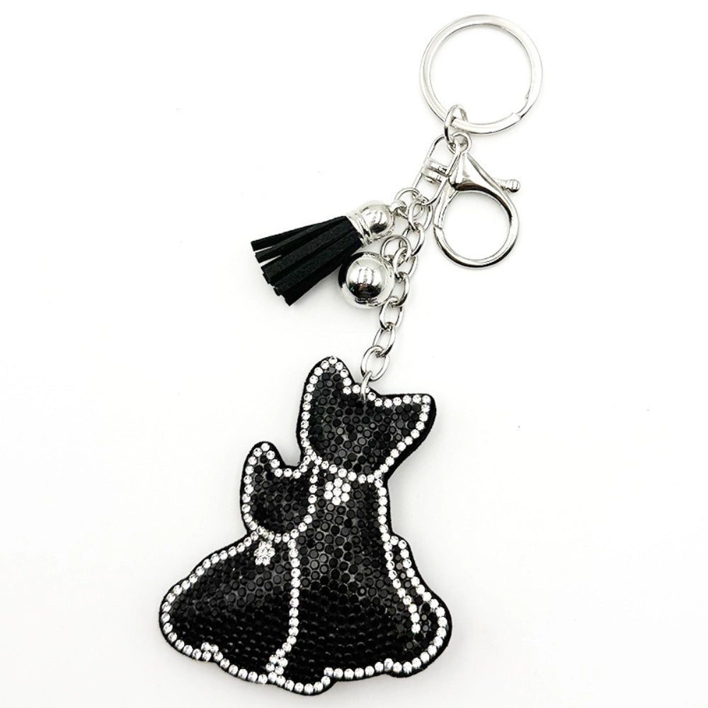 Black crystal rhinestone French Bulldog dog keychain charm with silver chain and black tassel on white background
