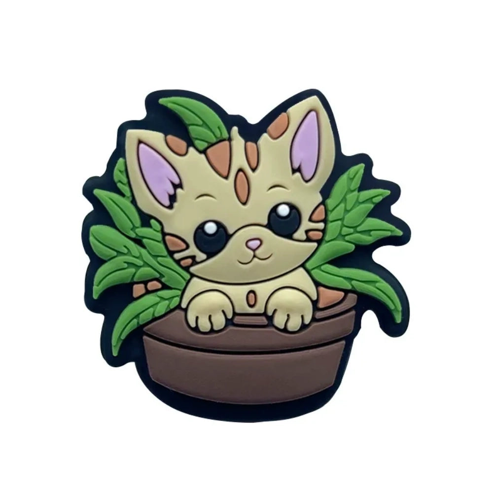 Six kawaii cat in flower pot silicone focal beads in gray and tan colorways with green plant leaves, displayed on a miniature white wooden bench — perfect for beadable pens, keychains, and badge reels. - 1
