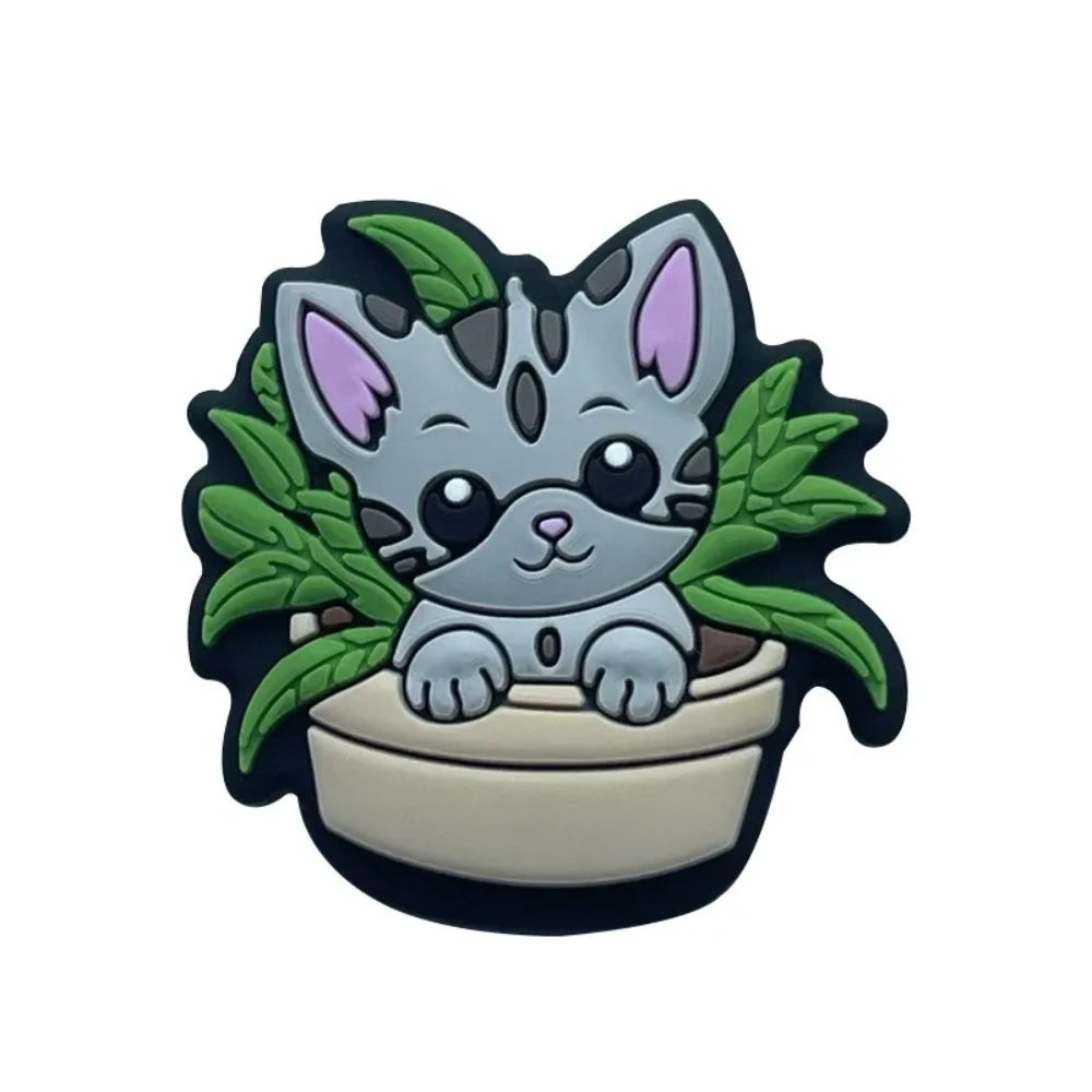 Six kawaii cat in flower pot silicone focal beads in gray and tan colorways with green plant leaves, displayed on a miniature white wooden bench — perfect for beadable pens, keychains, and badge reels. - 2