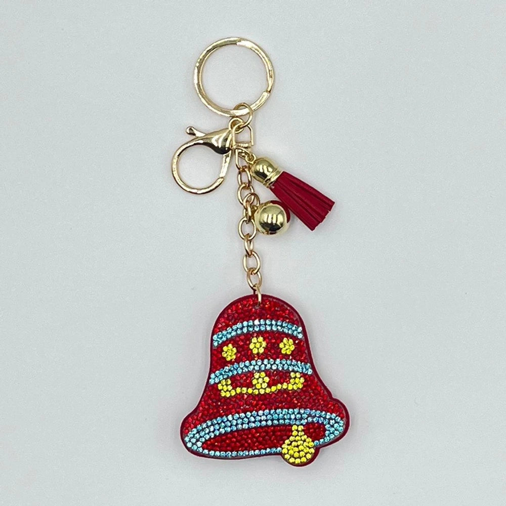 Set of 6 Christmas diamond painting keychains featuring Santa Claus, reindeer, Christmas tree, star, jingle bells, and mitten designs with tassels and jingle bell charms on silver and gold rings. - Bell