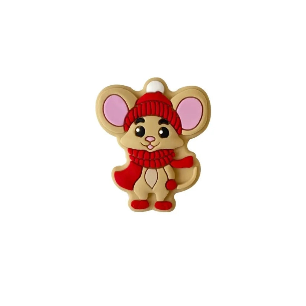 Two cartoon mouse silicone focal beads wearing Christmas winter hats and scarves, one in green and one in red, displayed in front of a white bowl on a beige background. - 2