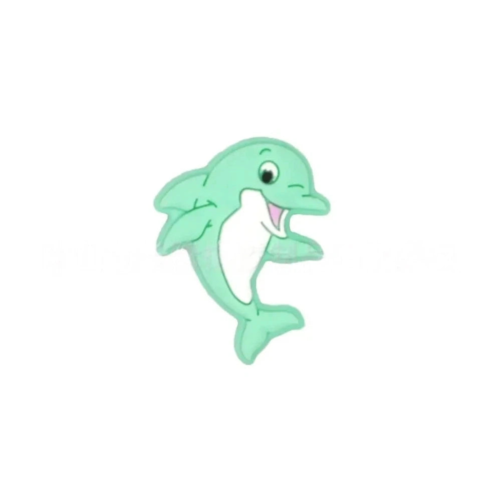 Seven colorful silicone dolphin focal beads in mint, pink, gray, navy, teal, light blue, and sage green with white belly detail, smiling cartoon style, for DIY jewelry and beadable crafts. - 7