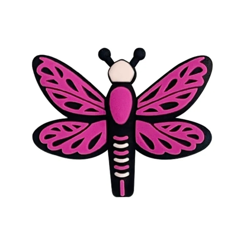 Seven colorful dragonfly silicone focal beads in pink, hot pink, and blue shades arranged on a pink background, featuring detailed wing patterns and black outlines. - Rose Red