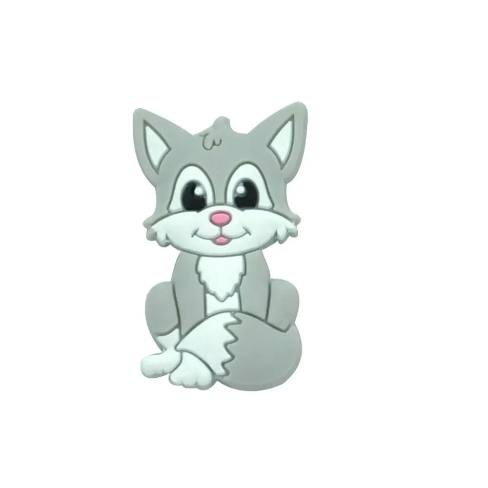 Eight cartoon fox silicone focal beads in assorted colors including gray, green, peach, blue, purple, pink, tan, and orange, featuring smiling faces and white chest details. - Gray
