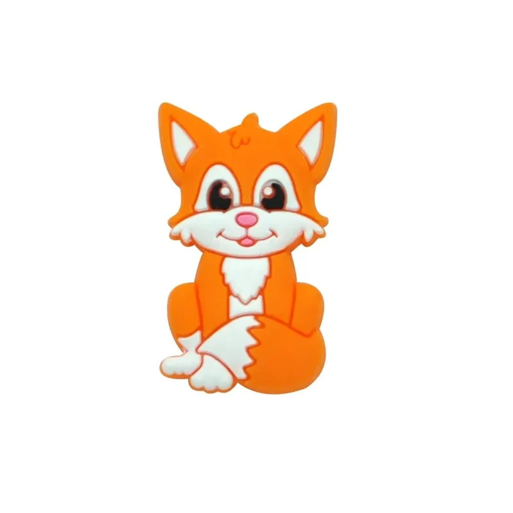 Eight cartoon fox silicone focal beads in assorted colors including gray, green, peach, blue, purple, pink, tan, and orange, featuring smiling faces and white chest details. - Orange