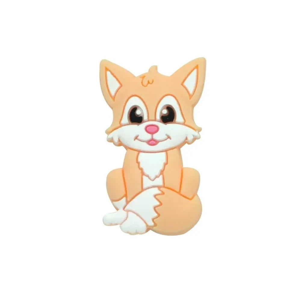 Eight cartoon fox silicone focal beads in assorted colors including gray, green, peach, blue, purple, pink, tan, and orange, featuring smiling faces and white chest details. - Pink