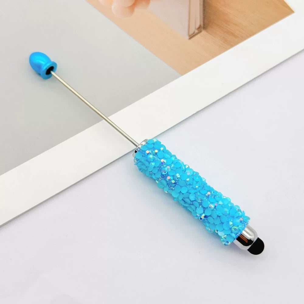 Set of 11 glitter rhinestone beadable pens in assorted colors including white, hot pink, black, multicolor, pink, light pink, teal, brown, purple, blue, and lavender, displayed on a white surface. - 5