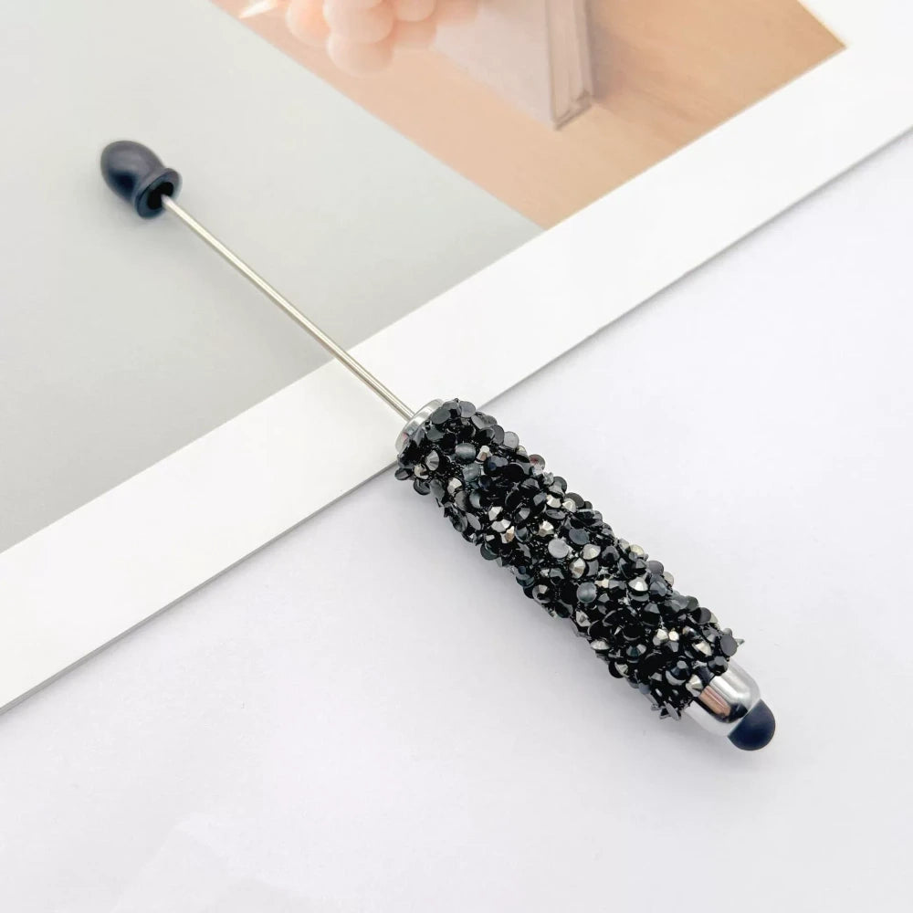 Set of 11 glitter rhinestone beadable pens in assorted colors including white, hot pink, black, multicolor, pink, light pink, teal, brown, purple, blue, and lavender, displayed on a white surface. - 7