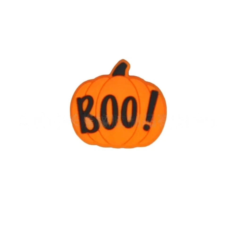 Set of 5 Halloween silicone focal beads including a BOO pumpkin, haunted house, black spider, and two bats displayed on a miniature white bench - Pumpkin