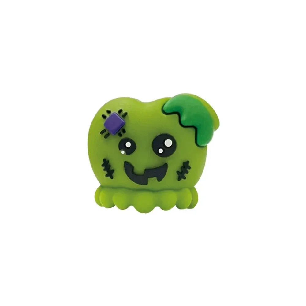 Halloween silicone 3D focal beads featuring skull and Frankenstein monster characters in white, green, and mummy designs, displayed on beadable pens with decorative round beads on a pink background. - Zombie