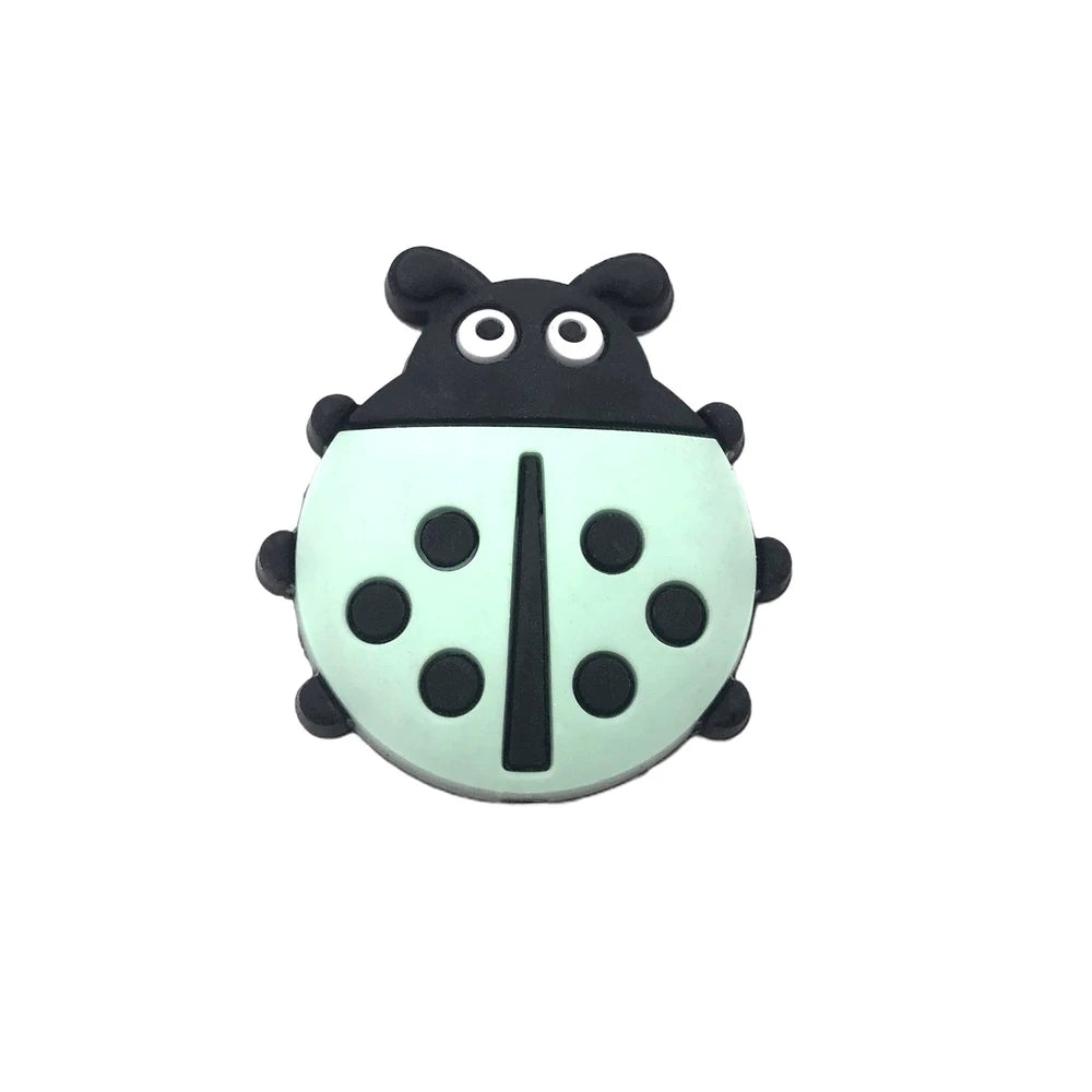 Eight colorful ladybug silicone focal beads in yellow, blue, white, mint, red, cream, gray, and teal with black spots and cartoon faces, used for beadable pens, keychains, and badge reels. - Mint Green