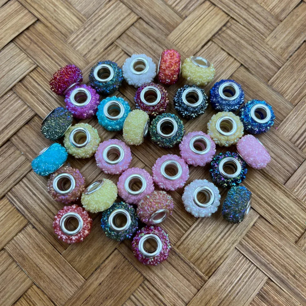 Assorted mixed color floral iridescent acrylic spacer beads with textured surfaces and silver-tone centers