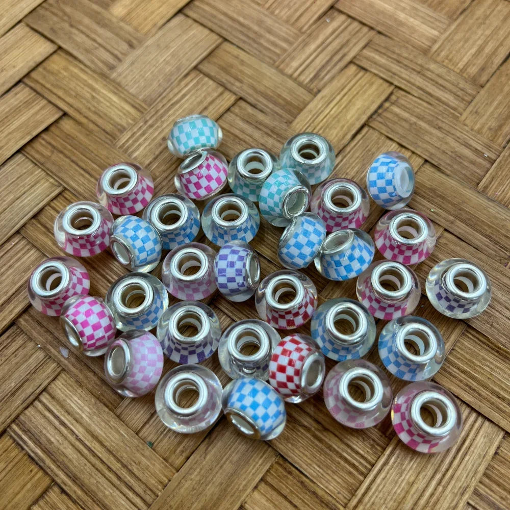 Assorted large hole pastel checkerboard acrylic spacer beads in pink, blue, mint, purple, and red with glossy transparent finish