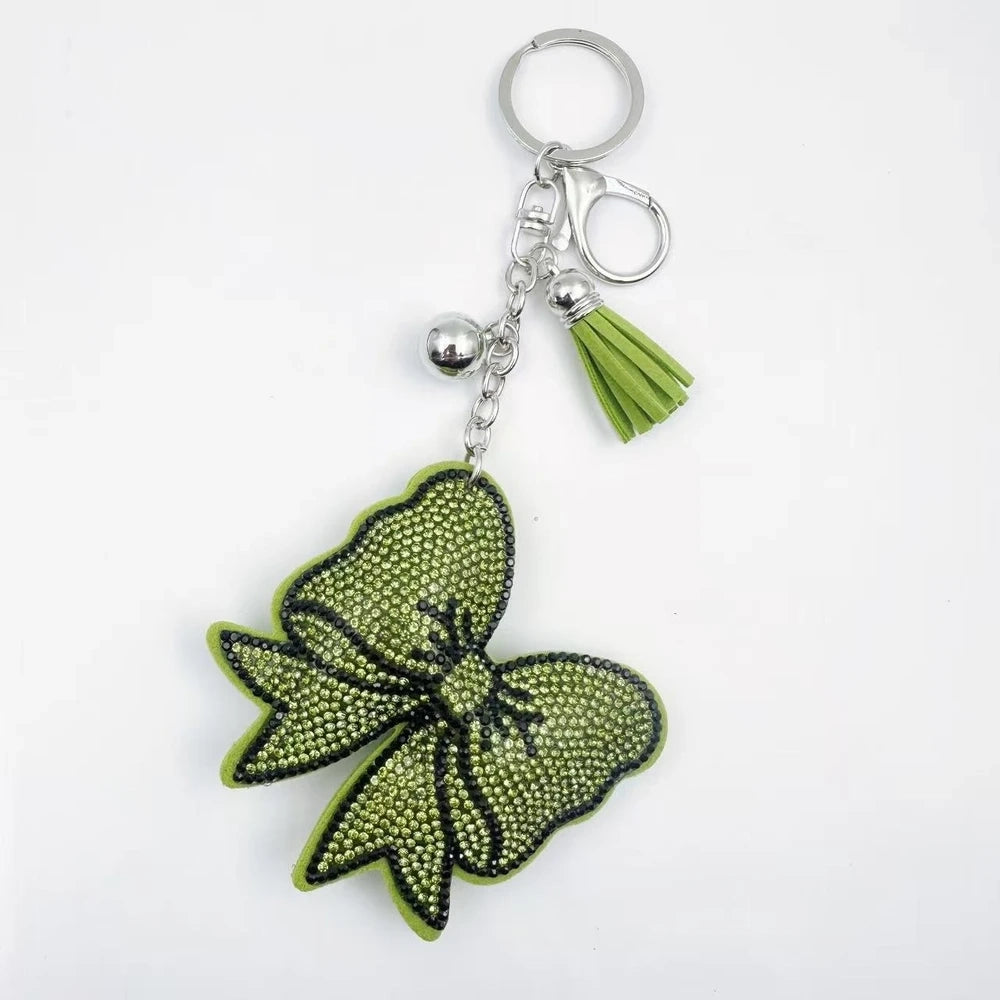 Large bow-shaped rhinestone fancy beads in silver, hot pink, lavender, and lime green on a white background. - Green