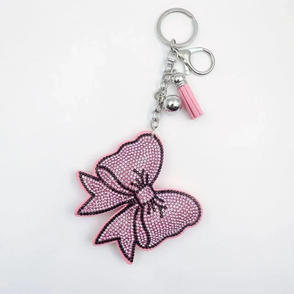 Large bow-shaped rhinestone fancy beads in silver, hot pink, lavender, and lime green on a white background. - Light Pink